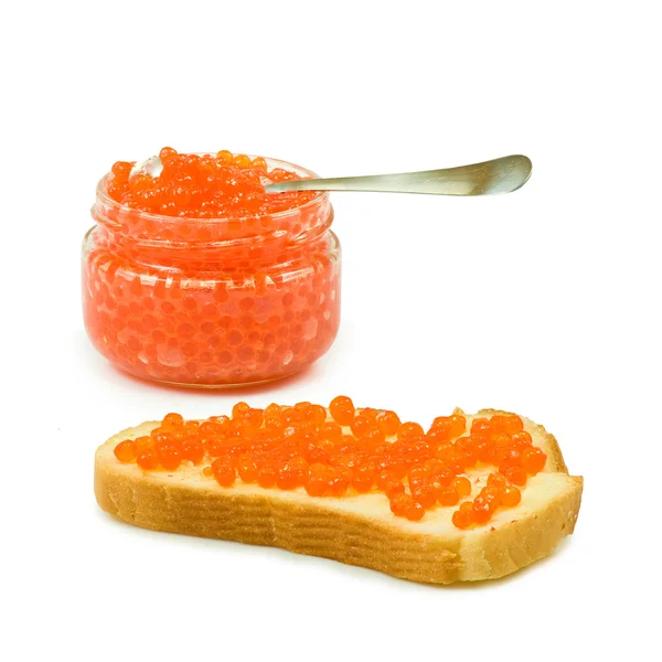Bread with red caviar and a jar with red caviar — Stock Photo, Image