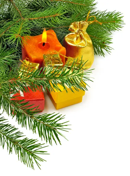 Image of a candle on the Christmas tree background closeup — Stock Photo, Image