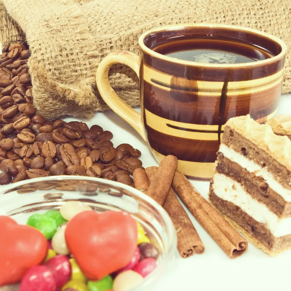 Isolated image of a cup of coffee and various sweets closeup — Stock Photo, Image