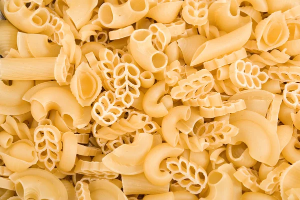 Many raw pasta closeup — Stock Photo, Image