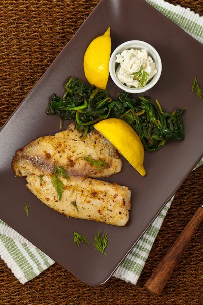 Tilapia with Sauteed Spinach — Stock Photo, Image