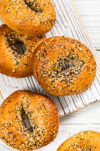 Freshly Baked Bagels Topped Sesame Seeds Poppyseeds Garlic Onion Selective — Stock Photo, Image