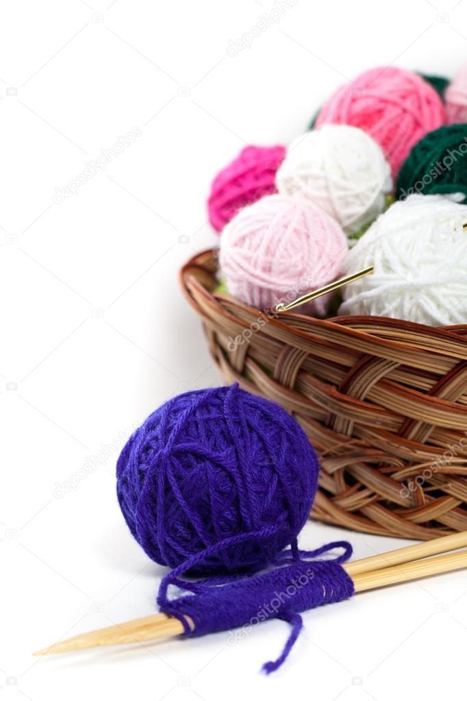 Colorful yarn balls in wicker basket