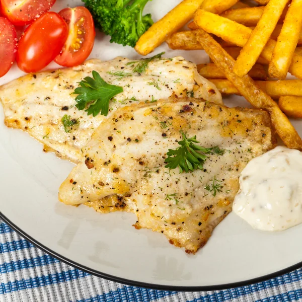 Fish dish fried fish fillet with vegetables — Stock Photo