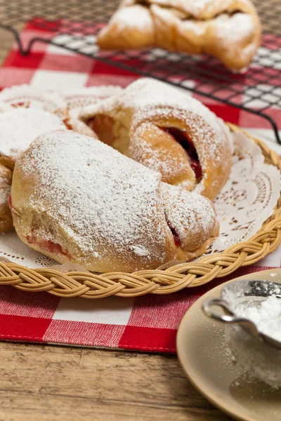 Pastry croissants filled with cherry jam — Stock Photo, Image