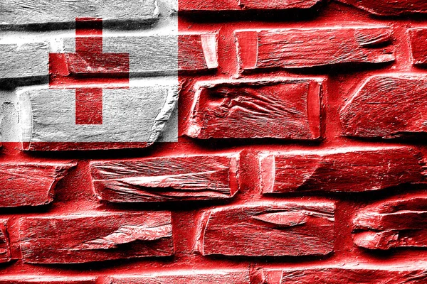 Parede de tijolo Tonga bandeira com algumas rachaduras e olhar vintage — Fotografia de Stock