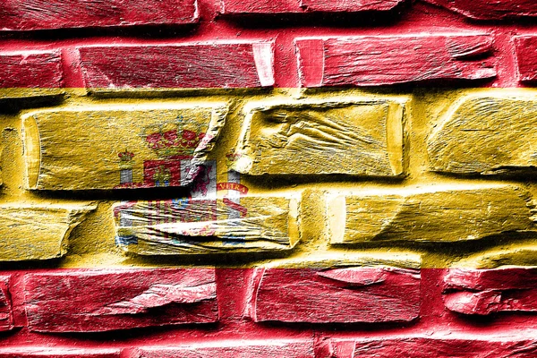 Brick wall Spanish flag with some cracks and vintage look — Stock Photo, Image