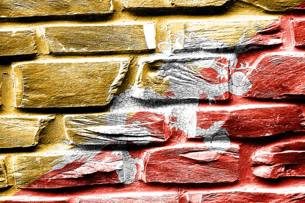 Brick wall Bhutan flag with some cracks and vintage look — Stock Photo, Image