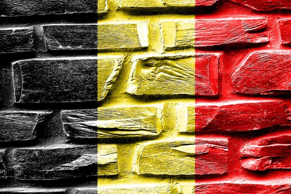 Muro de ladrillo Bandera de Bélgica con algunas grietas y aspecto vintage — Foto de Stock