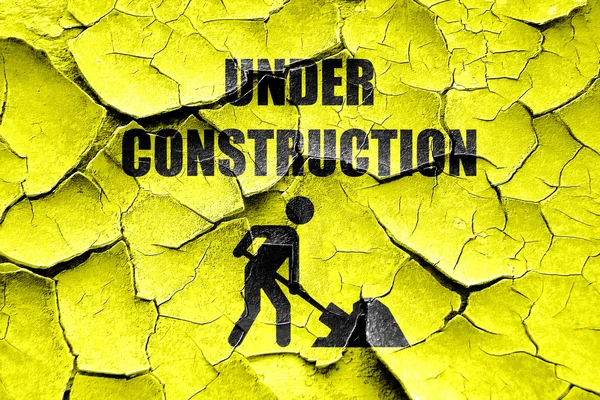 Grunge cracked Under construction sign — Stock Photo, Image