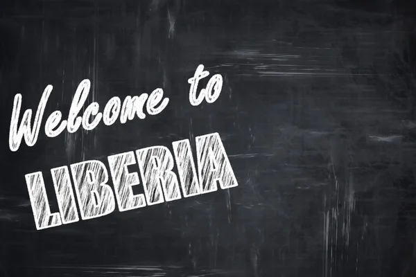 Fondo pizarra con letras de tiza: Bienvenido a liberia — Foto de Stock