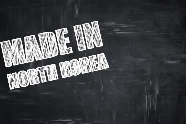 Schoolbord achtergrond met krijt letters: gemaakt in Noord-korea — Stockfoto