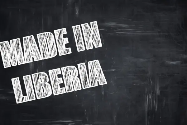 Доска фон с мелом буквы: Сделано в Либерии — стоковое фото