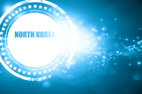 Timbro blu su uno sfondo scintillante: Saluti da nord kore — Foto Stock
