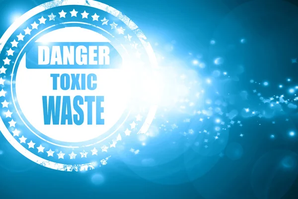 Blue stamp on a glittering background: Toxic waste sign — Stock Photo, Image