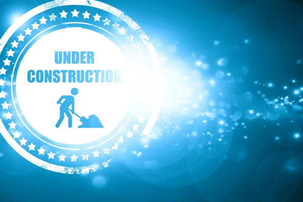 Blue stamp on a glittering background: Under construction sign — Stock Photo, Image