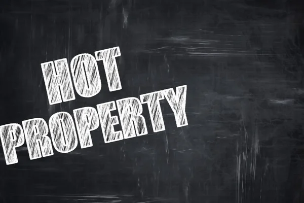 Svarta tavlan skrift: hot property — Stockfoto