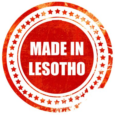Made in lesotho, grunge kırmızı kauçuk damga sıyrık beyaz bir backgr