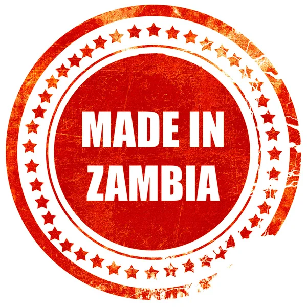 Зроблено в Замбії, грандж червоний каучуковий штамп на твердому білому backgro — стокове фото