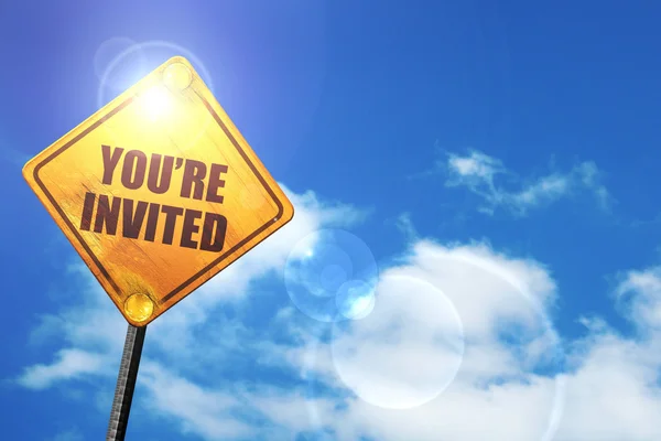 Yellow road sign with a blue sky and white clouds: you are invit — Stock Photo, Image