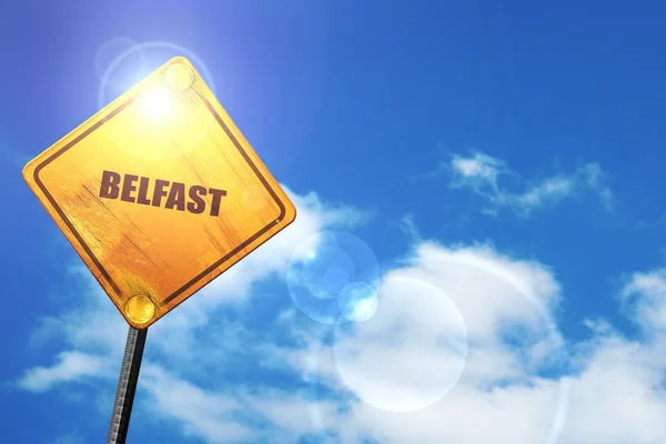 Yellow road sign with a blue sky and white clouds: belfast — Stock Photo, Image