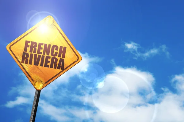 Yellow road sign with a blue sky and white clouds: french rivier — Stock Photo, Image