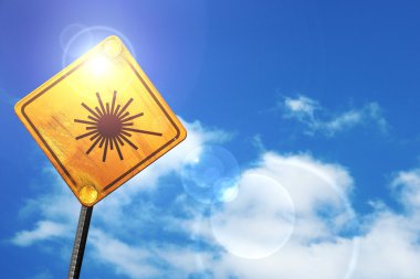 Sarı mavi bir gökyüzü ve beyaz bulutlar yol işaretiyle: lazer uyarı