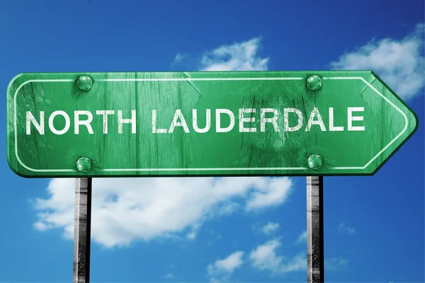 stock image north lauderdale road sign , worn and damaged look