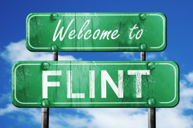 Flint vintage yeşil yol işareti mavi gökyüzü arka plan ile