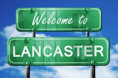 lancaster vintage green road sign with blue sky background clipart