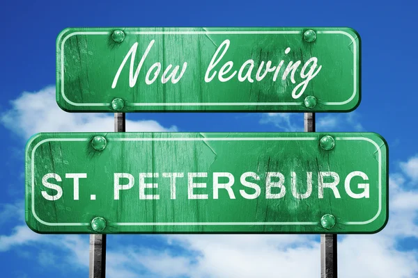 Leaving st. petersburg, green vintage road sign with rough lette — Stock Photo, Image