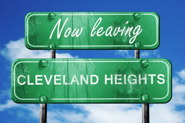 Leaving cleveland heights, green vintage road sign with rough le — Stock Photo, Image