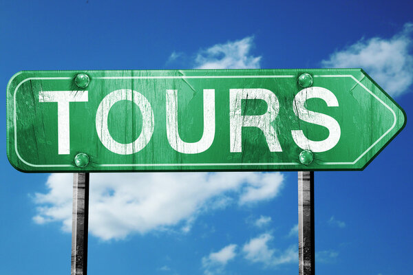 tours road sign, vintage green with clouds background