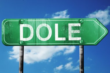 Dole yol işaret, vintage bulutlar arka plan ile yeşil