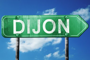 Dijon yol işaret, vintage bulutlar arka plan ile yeşil