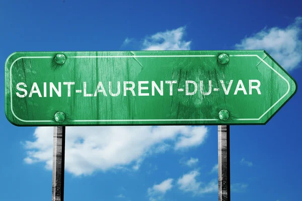 Saint-laurent-du-var road sign, vintage green with clouds backgr — Stock Photo, Image