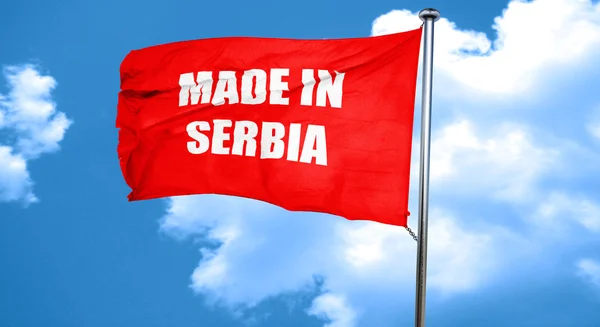 Hecho en serbia, representación 3D, una bandera ondeante roja —  Fotos de Stock