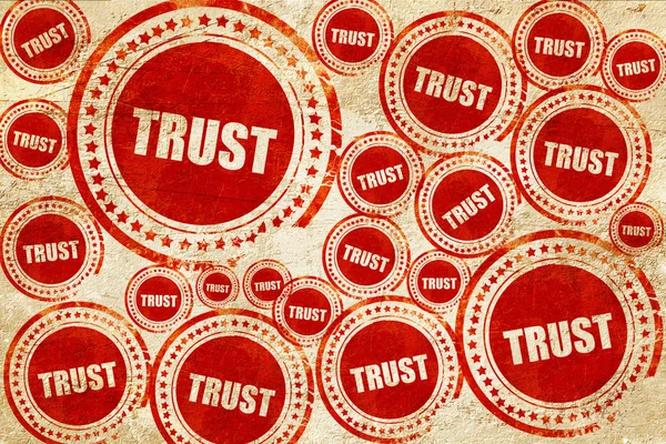 Confiança, selo vermelho em uma textura de papel grunge — Fotografia de Stock
