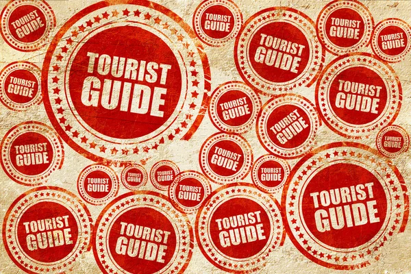 Туристичний гід, червона марка на гранжевій текстурі паперу — стокове фото