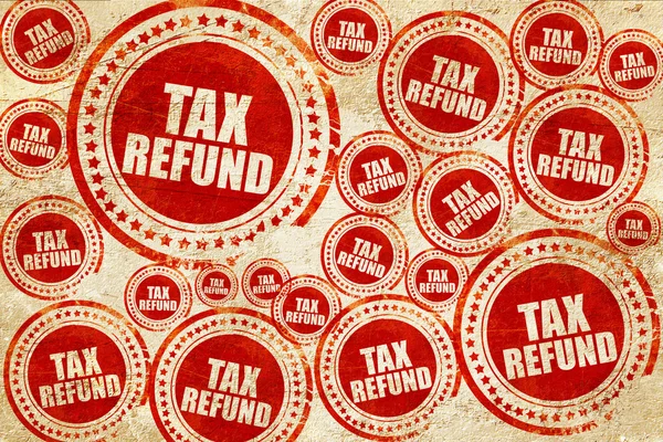 Devolución de impuestos, sello rojo en una textura de papel grunge — Foto de Stock