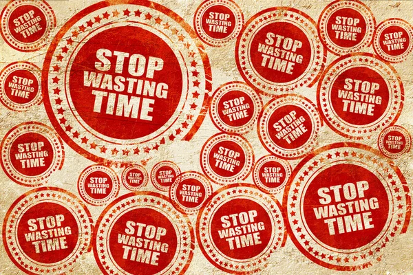 Stop wasting time, red stamp on a grunge paper texture — Stock Photo, Image