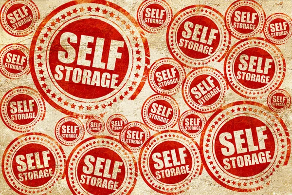 Self storage, sello rojo en una textura de papel grunge — Foto de Stock