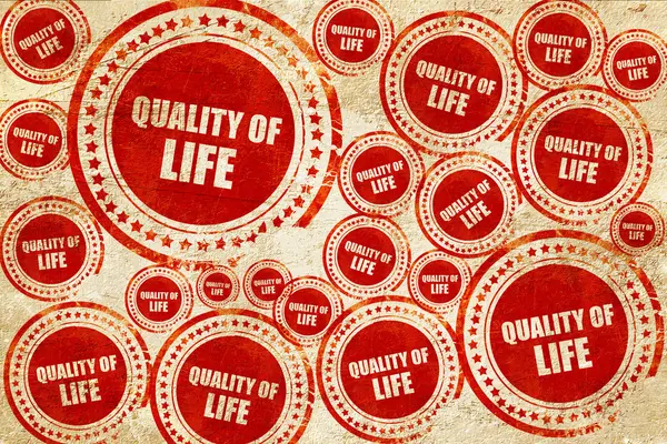 Qualité de vie, timbre rouge sur une texture de papier grunge — Photo
