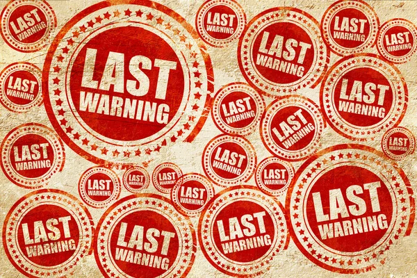 Última advertencia, sello rojo en una textura de papel grunge — Foto de Stock