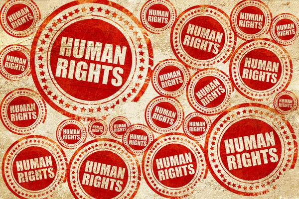 Derechos humanos, sello rojo en una textura de papel grunge — Foto de Stock