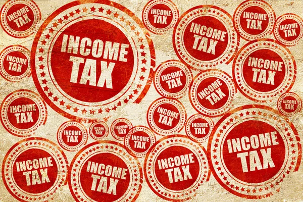Impuesto sobre la renta, sello rojo en una textura de papel grunge —  Fotos de Stock