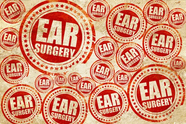 Chirurgie de l'oreille, timbre rouge sur une texture de papier grunge — Photo