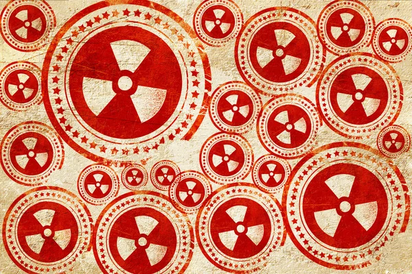 Fundo de perigo nuclear, selo vermelho em uma textura de papel grunge — Fotografia de Stock