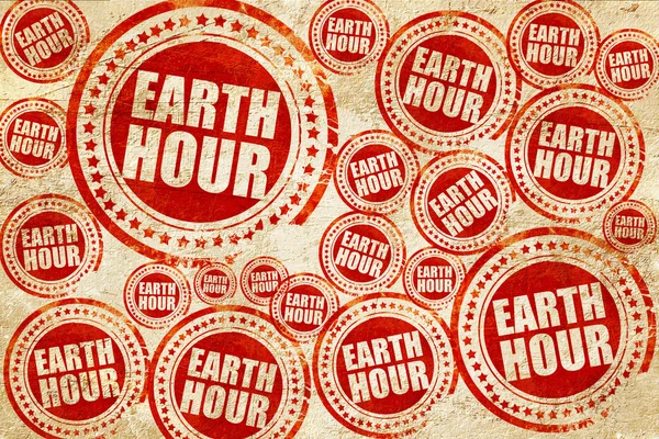 Earth Hour, roter Stempel auf Grunge-Papier — Stockfoto