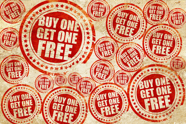 buy one get one free, red stamp on a grunge paper texture